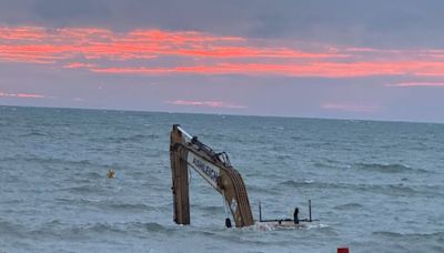 Huge excavator left submerged in sea off Welsh coast after 'malfunction'