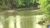 Investigators trying to identify human remains found in river