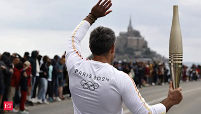 France's Bastille Day parade meets the Olympic torch relay in an exceptional year