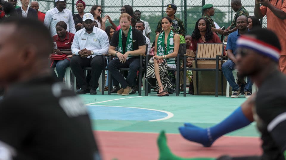 ‘We love you’: Harry plays volleyball with army veterans as he and Meghan get warm welcome in Nigeria