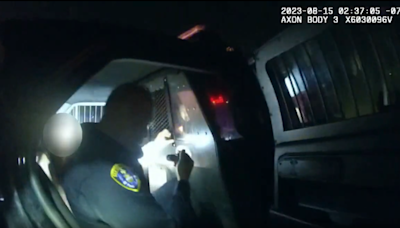 Video released of San Diego police officer locked in backseat with woman he was transporting