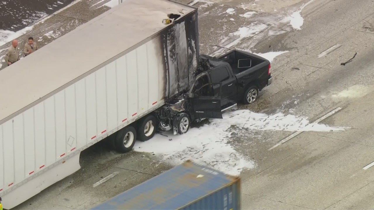 91 Freeway crash: Driver suffers non-life-threatening injuries after truck gets pinned under big rig