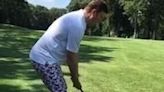 man in crazy golf pants misses ball completely and digs up dirt