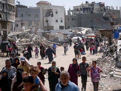 Dozens killed and thousands flee as Israel shrinks ‘humanitarian zone’ in Gaza