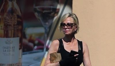 Melanie Griffith displays her fit figure in fitted tank top