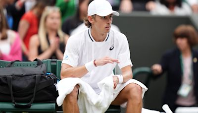 Alex De Minaur reaches first Wimbledon quarter-final but suffers injury scare