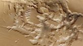 Explore a mysterious, crinkly Mars valley in this flyover video