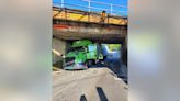 Tractor-trailer becomes jammed under overpass in Ringgold