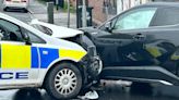 Driver hospitalised after police car collision