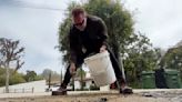 Arnold Schwarzenegger kicks asphalt, takes on pesky L.A. potholes. City says one was a service trench