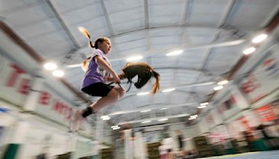 AP PHOTOS: Russian kids ride sticks with a horse's head in hobby horsing competition