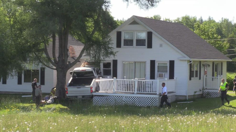 Driver dies after truck crashes into home in Hampden