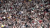 No masks required, but Japanese fans still wear them at WBC