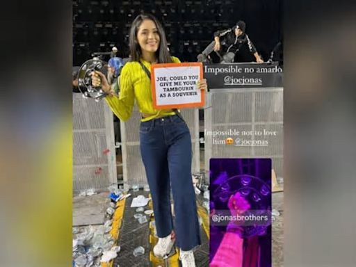 Integrante de Jonas Brothers regala pandereta a una venezolana durante concierto en Chile