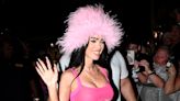 Megan Fox brings out her inner Pamela Anderson in pink fluffy hat and matching outfit