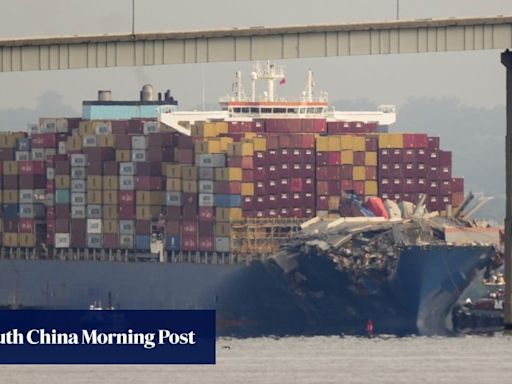 Crashed ship that took down Baltimore bridge refloated, towed from channel