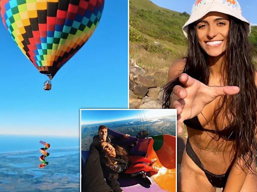 Moment woman skydives out of a waterslide from a hot air balloon