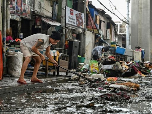 'Back to zero': Manila flood victims clean up, start again