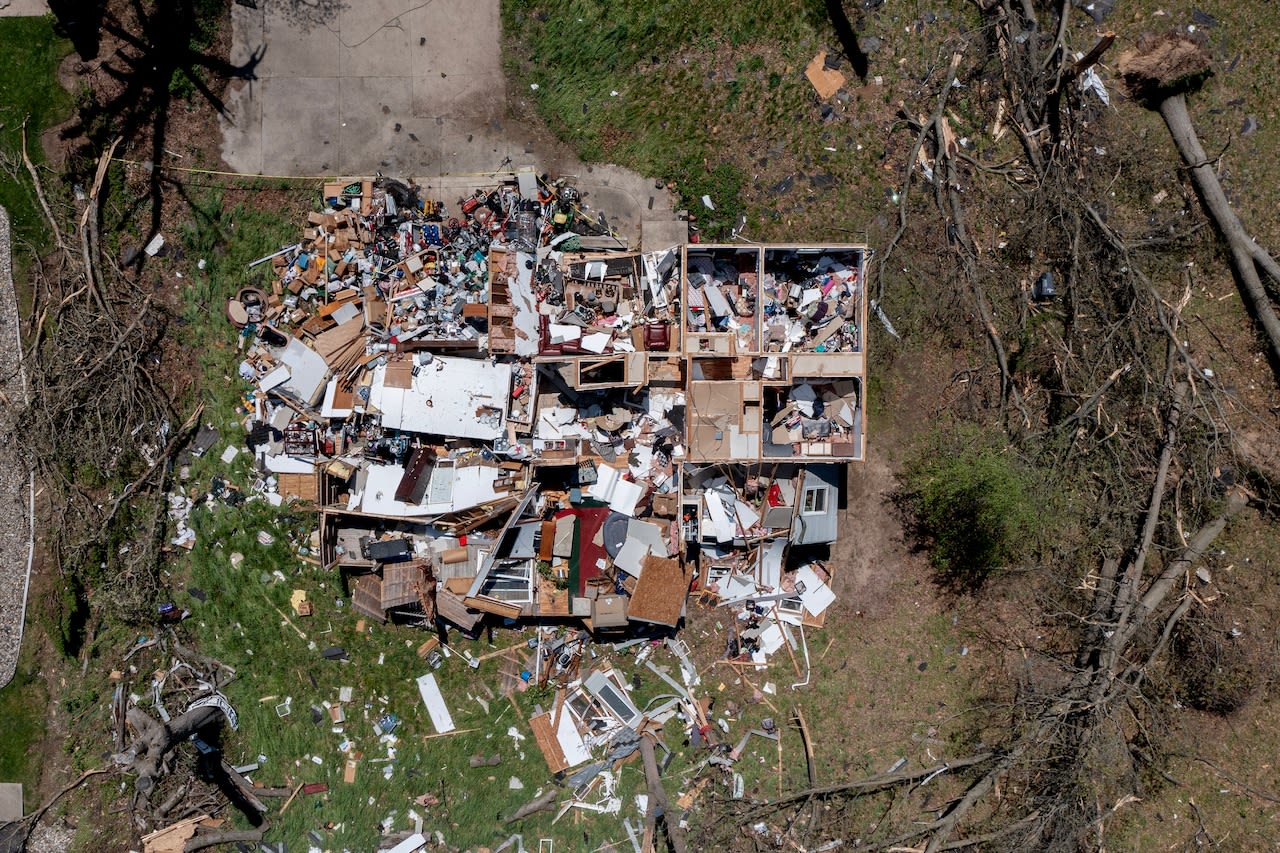 Aerial footage of tornado damage shows homes ripped to shreds, trees flattened