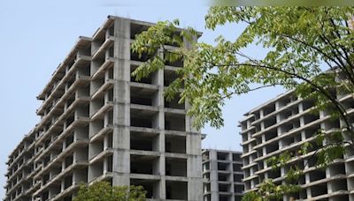 Budget 2024 | Real Estate stocks DLF, Godrej Properties fall despite cut in tax rates — Explained - CNBC TV18