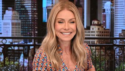 Kelly Ripa looks beyond tiny as she poses for a photo in the Live studios