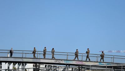 In and on the water, French troops secure the River Seine for the Paris Olympics opening ceremony