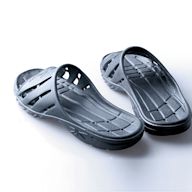 Slides with sporty designs and materials, perfect for use as post-workout footwear or for casual outings. Often feature a thick sole for added cushioning and support.