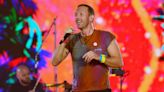 Chris Martin serves up coffees at homeless charity's shop