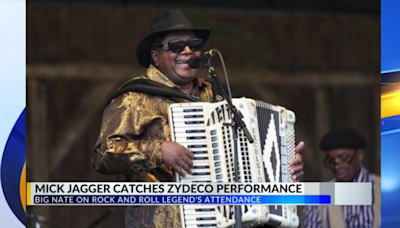 Mick Jagger watches Zydeco legend Nathan “Big Nate” Williams Sr. perform at Jazz Fest