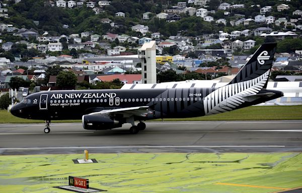 A crew member hit the ceiling and a passenger was scalded by spilled coffee as turbulence caused 'pandemonium' on a flight in New Zealand