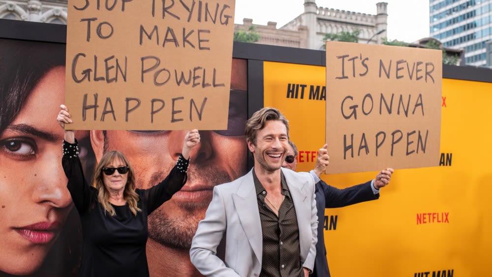 Glen Powell’s Parents Showed Up on His Red Carpet With Signs Trolling Him: ‘Stop Trying to Make Glen Powell Happen...