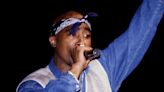 Tupac Shakur's record label received an anonymous call from someone threatening to 'finish him off' after the rapper had been shot, says business partner