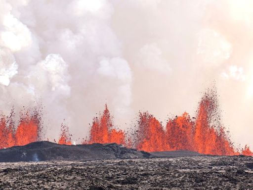 Iceland volcano dramatically erupts again as streams of lava reach town’s defensive walls