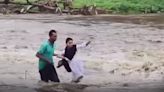 MP: School Girl Gets Stuck While Crossing Over-Flowing River Amid Heavy Rains, Rescued By Braveheart