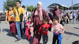 Internet and phone lines cut off in Gaza, Israel strikes refugee camp, Rafah crossing opens for some