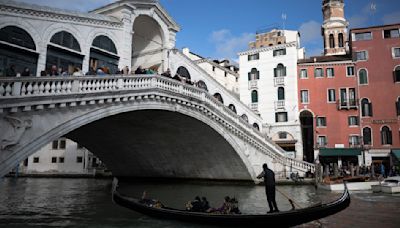 Venice residents clash with riot police as city launches world’s first tourist entry fee