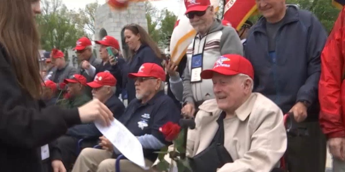 Southern Nevada veterans greeted by students with roses at WWII Memorial in Washington D.C.