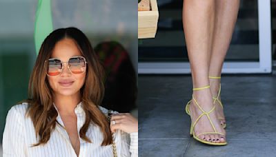Chrissy Teigen Straps Into Yellow Bottega Veneta Sandals for Mother’s Day Pop-Up Shop