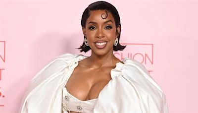 Kelly Rowland is angelic in sumptuous white gown with a TRAIN as she attends Fashion Trust US Awards