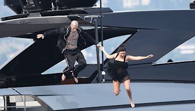 Kourtney Kardashian & Travis Barker Jump Off Their Super Yacht The Morning After Their Wedding