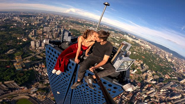 'Rooftopping is my art form': The death-defying couple who climb the world's tallest skyscrapers