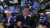 Nasdaq outperforms as investors cheer Microsoft, Dow transports sink