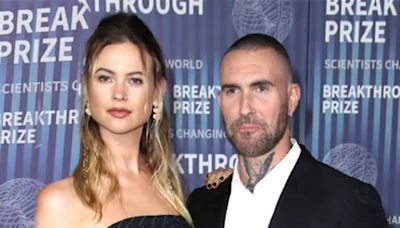 Behati Prinsloo dazzles in strapless pinstriped gown while Adam Levine sports a dapper suit at 10th Annual Breakthrough Prize ceremony in LA