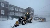 A car dealer used a payloader to drag a generator 4 hours through a blizzard to help Buffalo neighbors who were trapped without heat in the storm