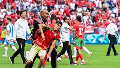 Fans storm pitch and throw bottles as Argentina v Morocco descends into chaos to kick off Olympics