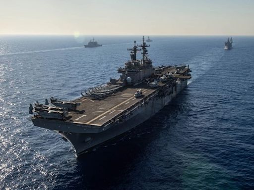 Photos show the USS Eisenhower carrier strike group's 9-month deployment leading the ferocious Houthi fight
