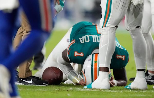 Miami quarterback Tagovailoa diagnosed with concussion after hitting head on turf, leaves Dolphins-Bills game