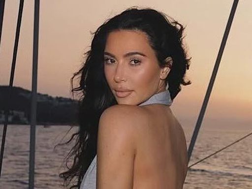 Kim Kardashian poses in a backless top during 'sunset sail' on yacht