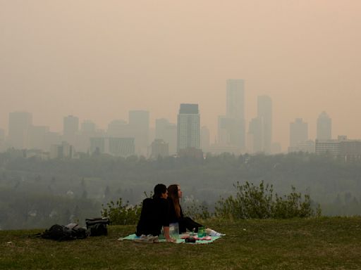 Wildfire in Canada's British Columbia forces thousands to evacuate. Winds push smoke into Alberta