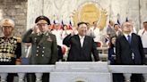Kim Jong Un views new weapons at military parade with Russian, Chinese officials